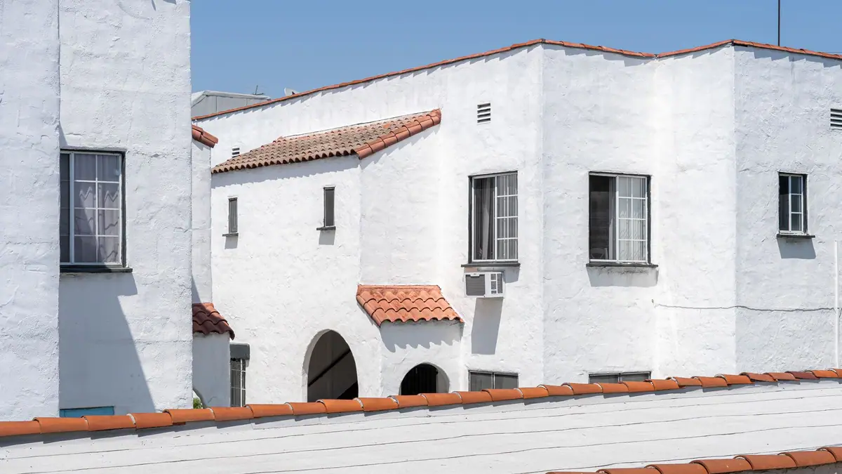 White stucco Spanish-style homes with clay tile roofs