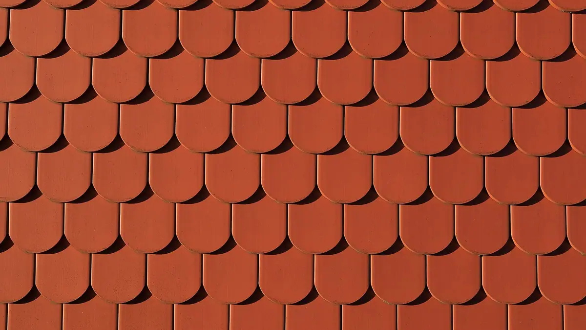 Terracotta roof tiles in an overlapping pattern